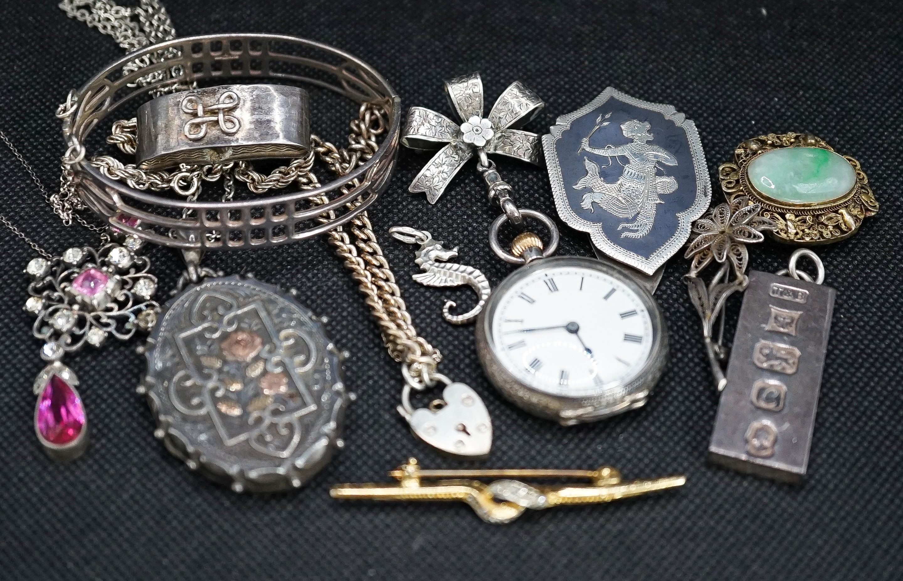 A silver fob watch, a late Victorian silver oval locket and other items of minor jewellery.